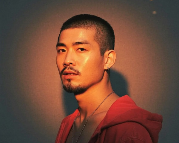 Portrait of a Young Man in a Red Hoodie with Beard