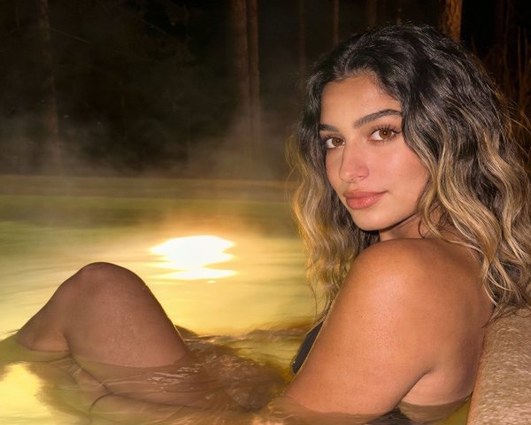 Latina Woman in Black Bikini Relaxing in Hot Tub