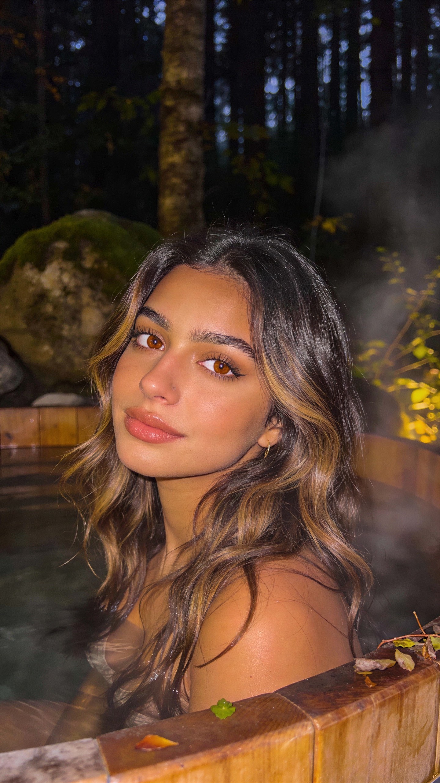 Close-up Portrait of a Woman in a Hot Tub at Night