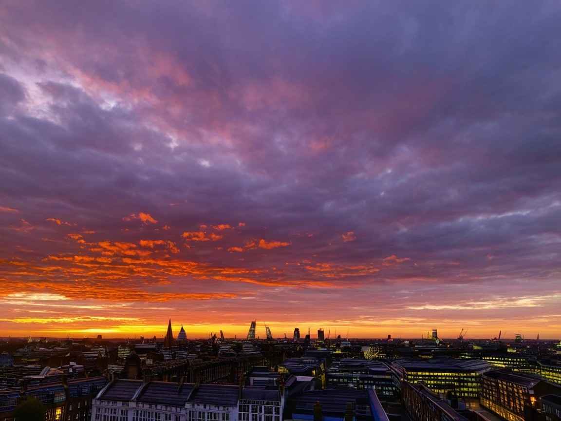 Vibrant Sunset Over a Bustling City Skyline
