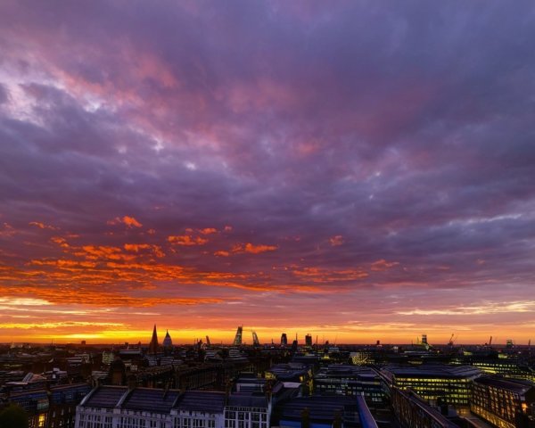 Vibrant Sunset Over a Bustling City Skyline