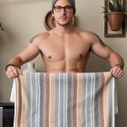 Young man with tattoos and beanie in a blurred setting