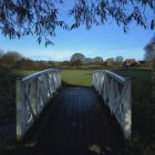 Grand Bridge Over Reflective Water in Mystical Setting