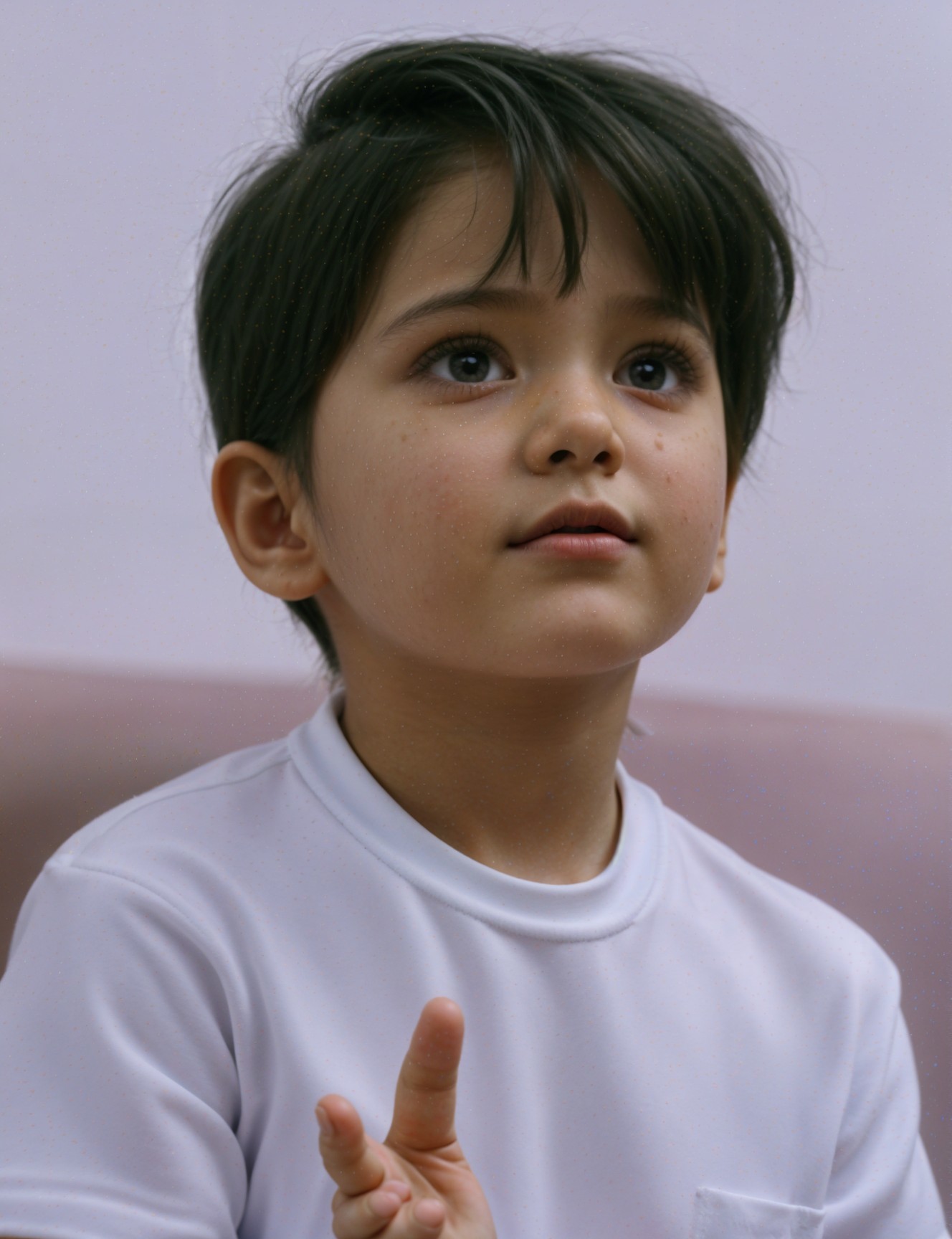 Young child with black hair and curious expression