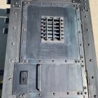 Large Gray Door with Decorative Metal Studs and Bubbles