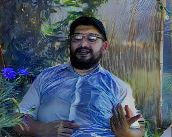 Man at Table Surrounded by Greenery and Flowers
