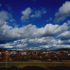 Dramatic Sky with Clouds Over a Village Landscape