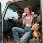 Medium Shot of Man and Woman in White Truck