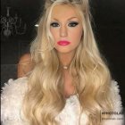 Elegant Woman in Sheer Gown with Gold Crown