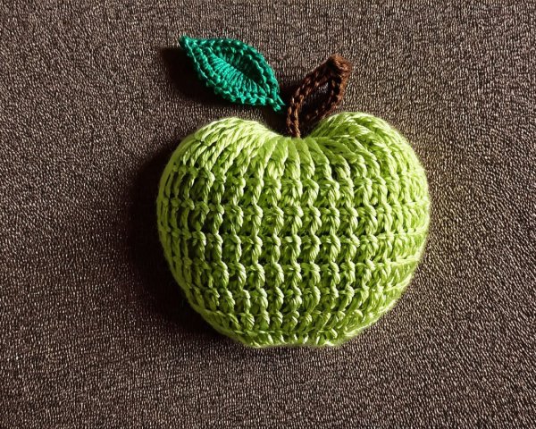 Handmade Crochet Apple on Coarse Woven Fabric