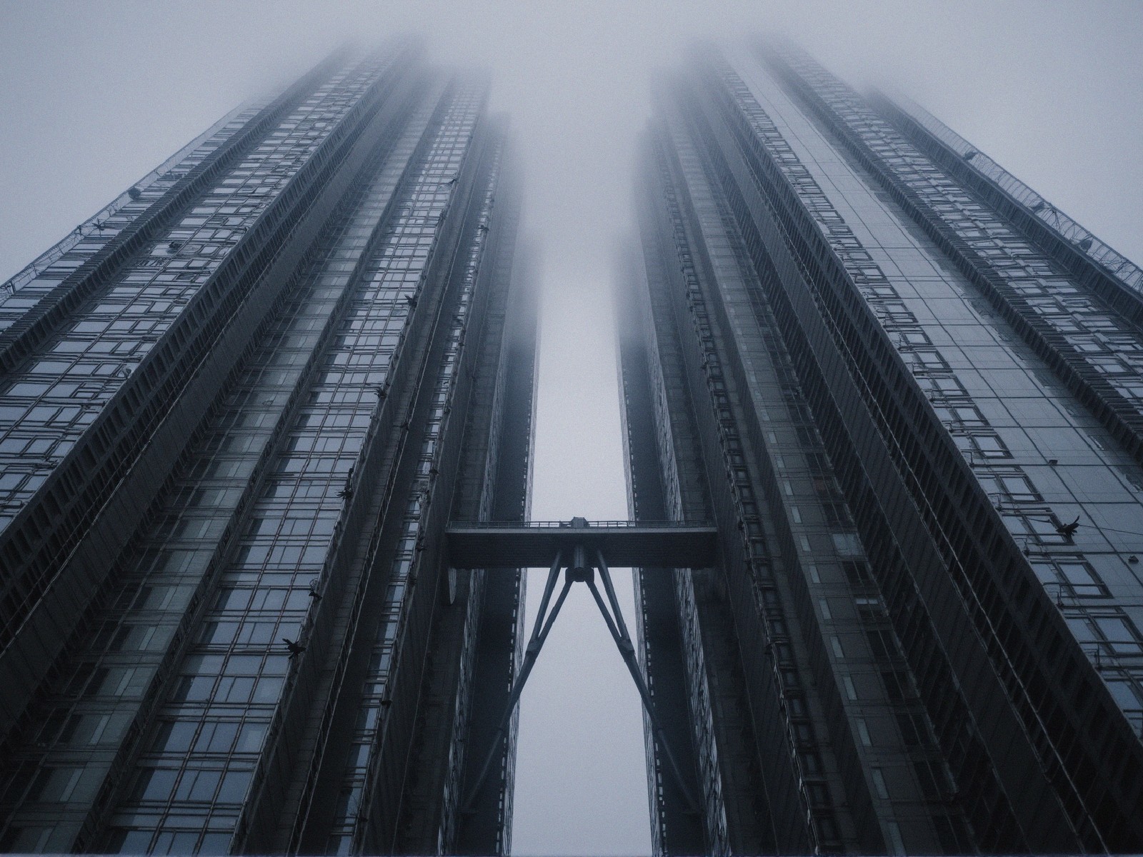 Skyscrapers in Fog with Glass Facades and Scaffold