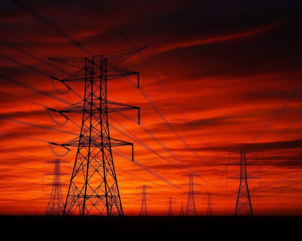 Silhouette of Power Lines at Sunset with Vibrant Sky
