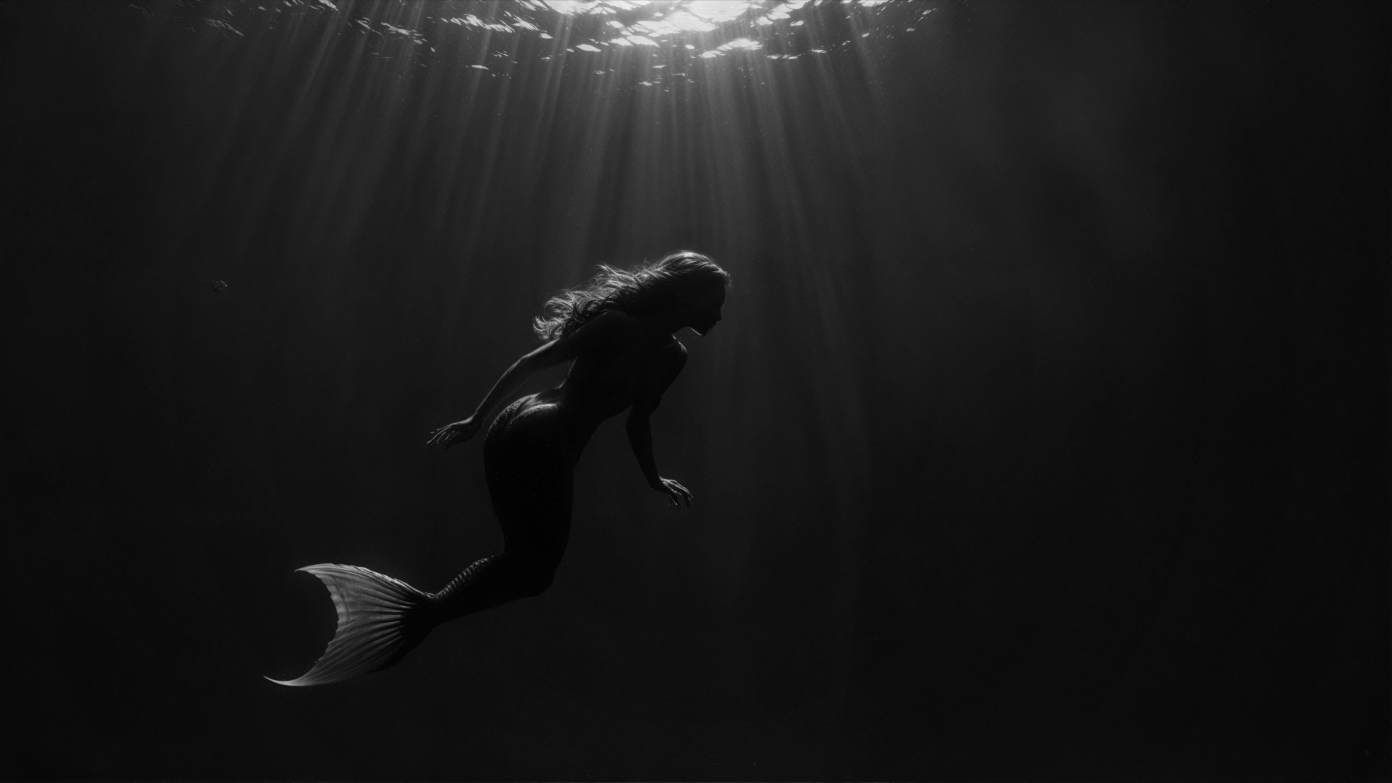 Solitary Mermaid in Ethereal Underwater Scene