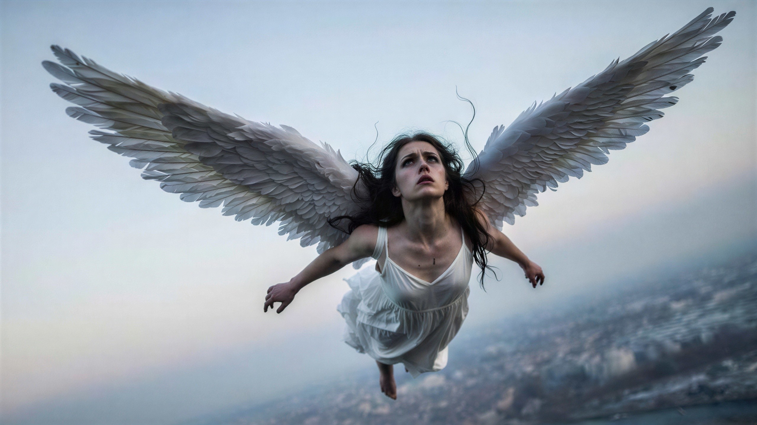 Young Woman with Wings in Dramatic Sky Scene