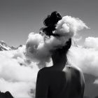 Silhouette of Woman Amid Ethereal Clouds and Mountains
