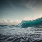 Dramatic Ocean Wave with Turquoise and Blue Hues