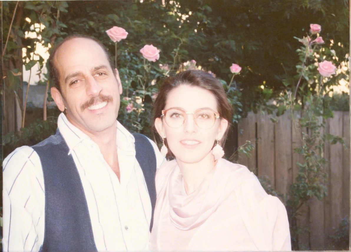 Couple in a Garden Surrounded by Blooming Roses
