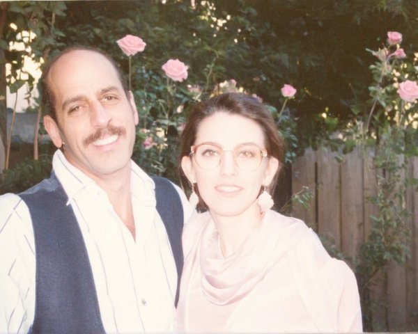 Couple in a Garden Surrounded by Blooming Roses