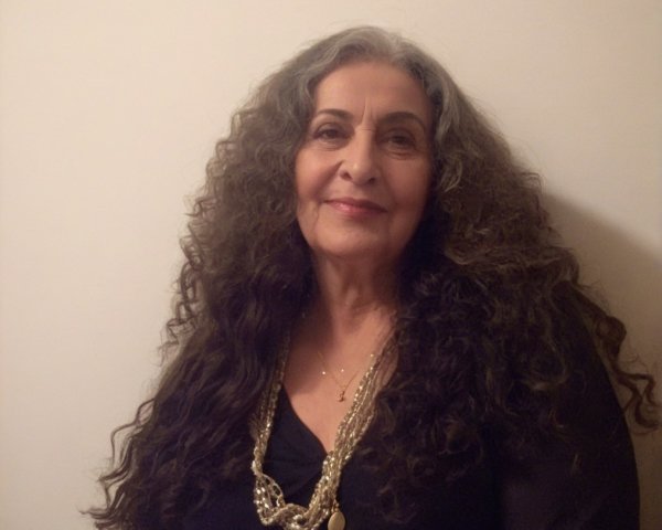 Woman with Long Curly Hair and Elegant Accessories