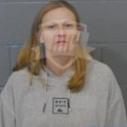 Elegant woman in white dress with blonde hair and blue eyes