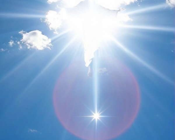 Bright Sunlight and Clouds in a Blue Sky Scene