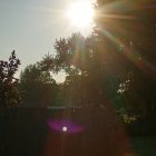 Jesus Christ Figure with Cross and Sword in Sunlight