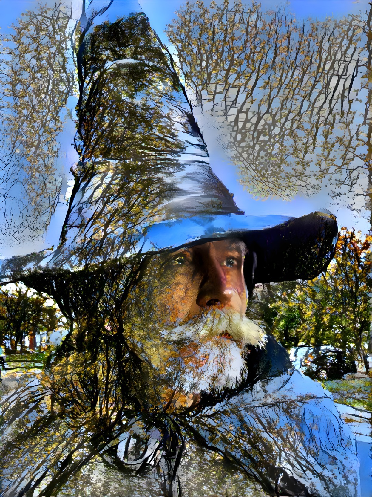 Close-Up of a Man in a Pointed Hat Surrounded by Nature