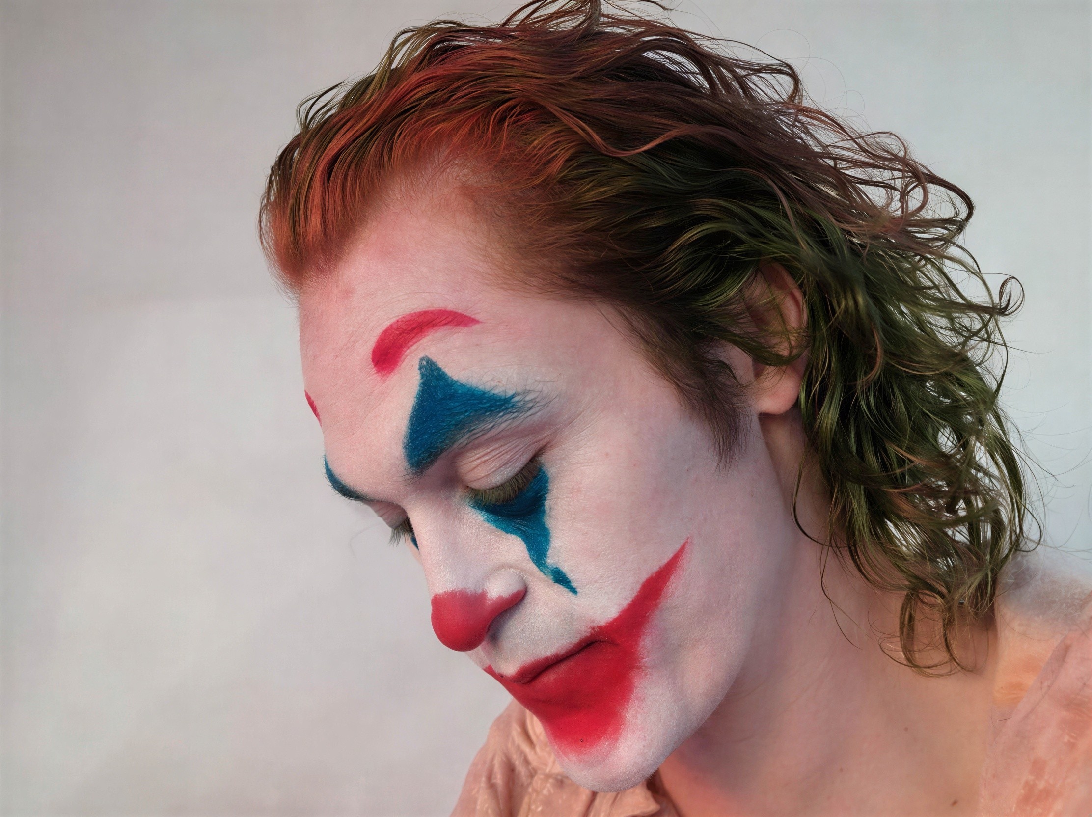 Close-up of a person in Joker-inspired clown makeup