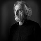 Portrait of a man in a dark blazer with serious expression