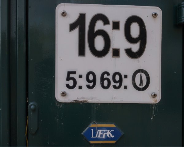 Weathered Sign with Numbers and Branding Details