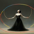 Dancer in Black Gown Posed with Colorful Hoops