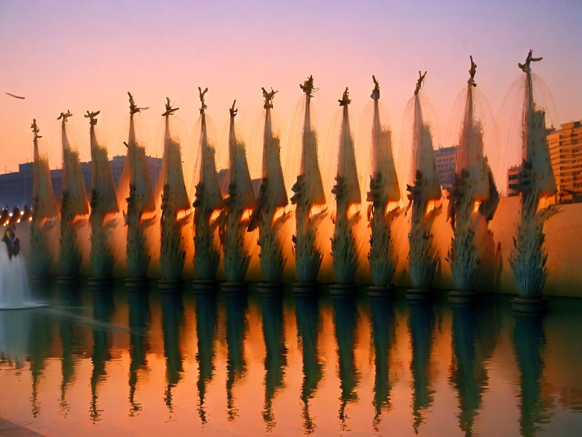 Illuminated Water Fountains at Sunset Display