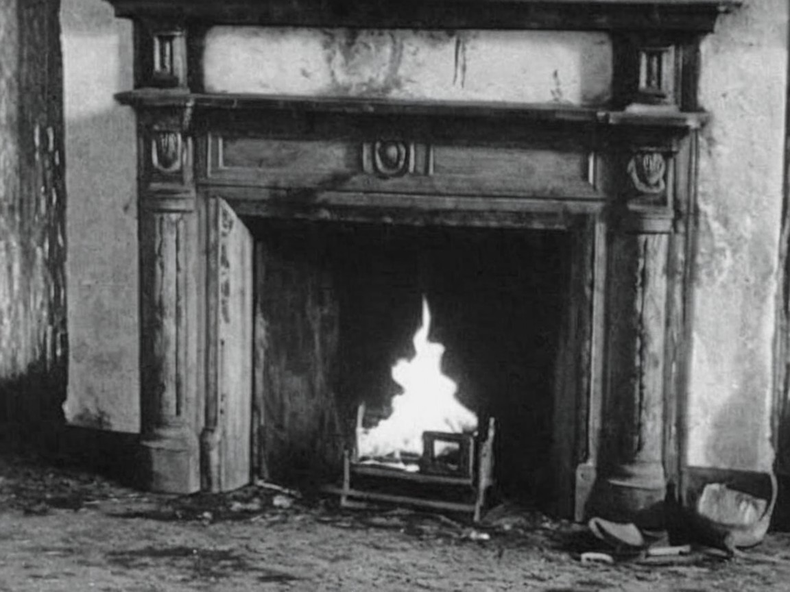 Vintage Fireplace with Ornate Wooden Mantel and Fire