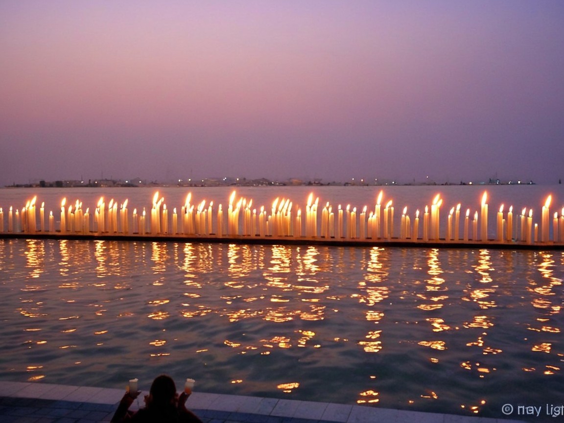 Twilight Scene with Candles by the Water's Edge