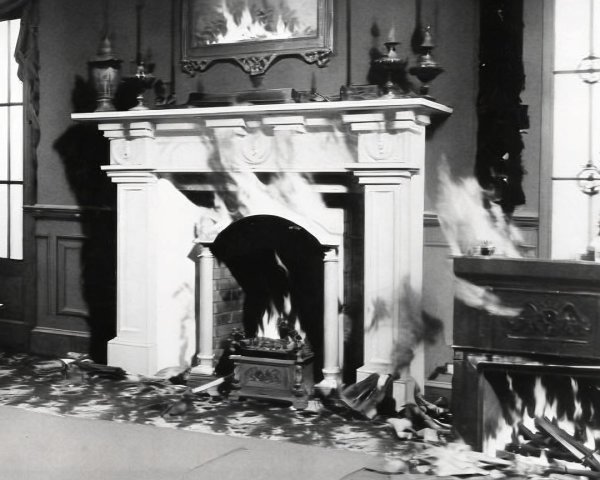 Dramatic Room with Ornate Fireplaces and Smoke