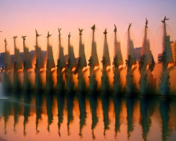 Illuminated Water Fountains at Sunset Display