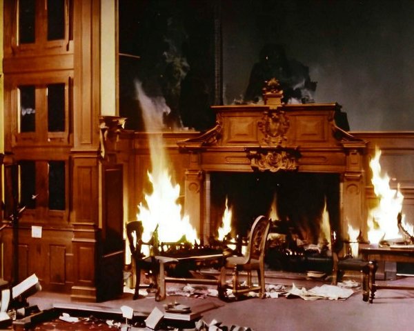 Room in Flames with Charred Books and Furniture