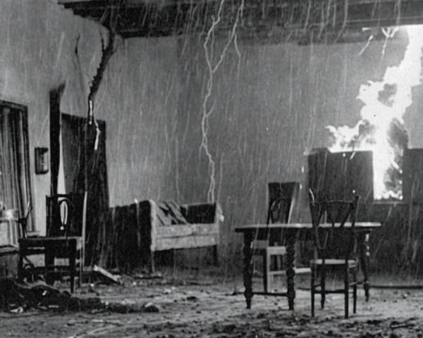 Abandoned Room with Debris and Raging Fire