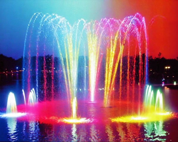 Vibrant Fountain Display in Serene Nighttime Setting