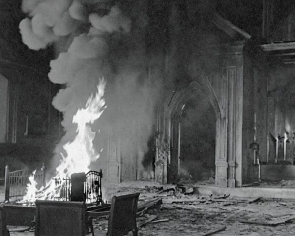 Interior of a building engulfed in smoke and flames