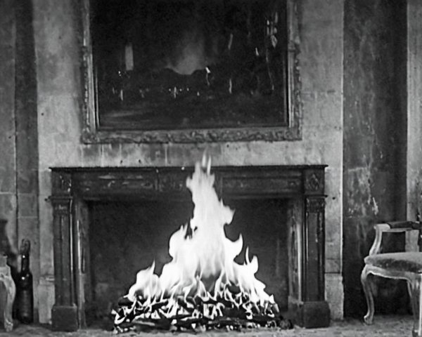 Cozy Fireplace with Elegant Mantel and Vintage Chairs