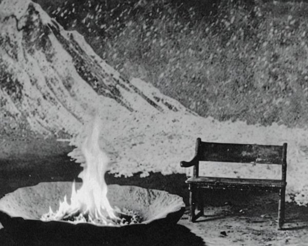 Wooden Bench by Fire Pit with Mountain Silhouettes