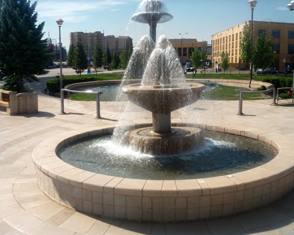 Modern multi-tiered fountain with cascading water display