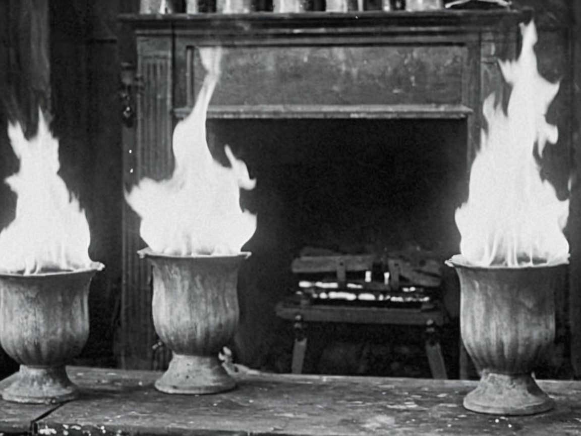 Flames on Antique Urns in a Dimly Lit Room