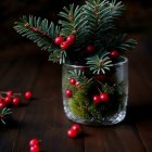 Festive Evergreen Arrangement with Red Berries and Candles