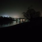 Abstract Riverside Scene at Dusk with Colorful Reflections