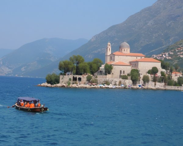 Coastal Scene with Boat and Island Church Overview