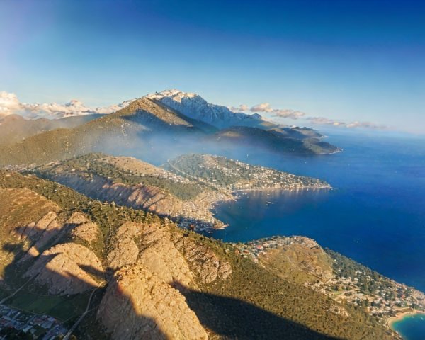 Aerial View of Coastal Landscape with Mountains and Villages