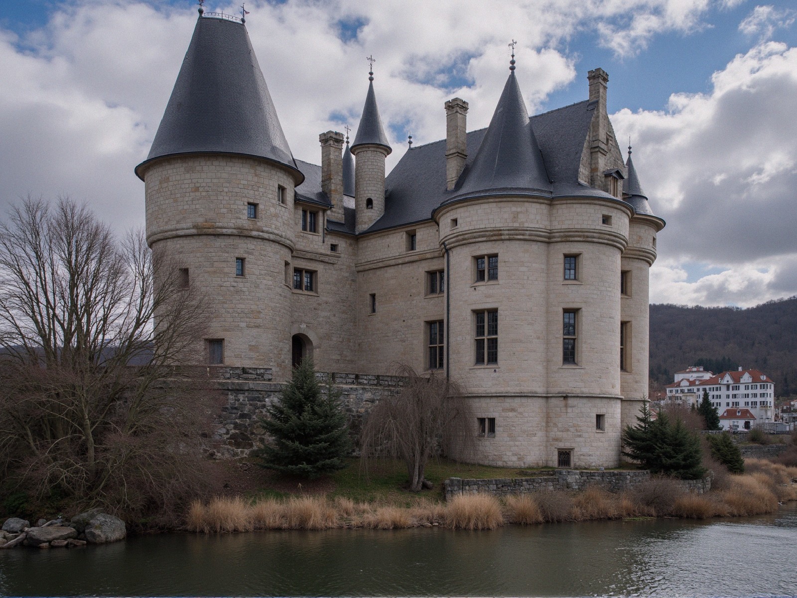 Majestic stone castle by tranquil river with turrets