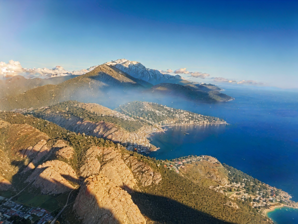 Aerial View of Coastal Landscape with Mountains and Villages